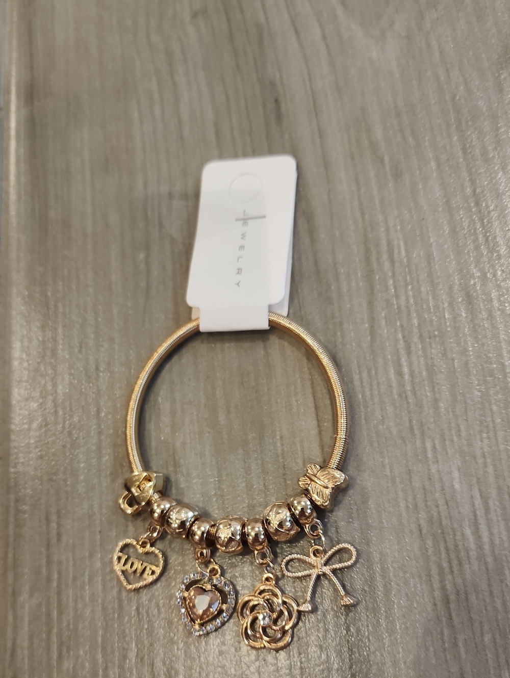 NWT Goldtone Stretchy Charm Bracelet